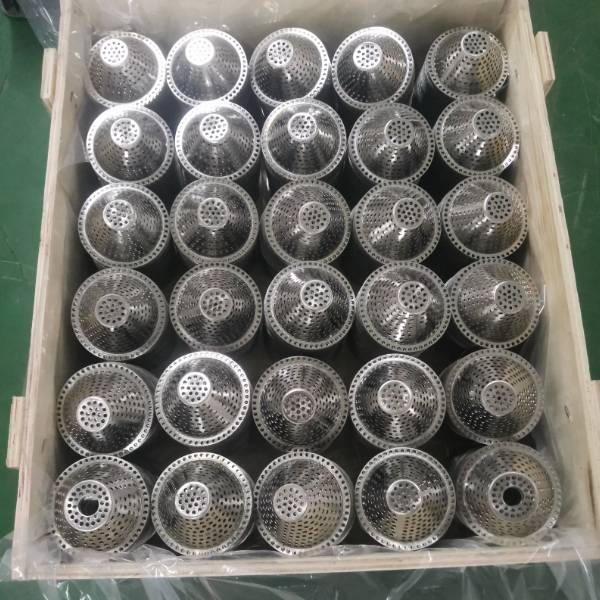 Bowl-shape perforated filters are placed in a wooden case.