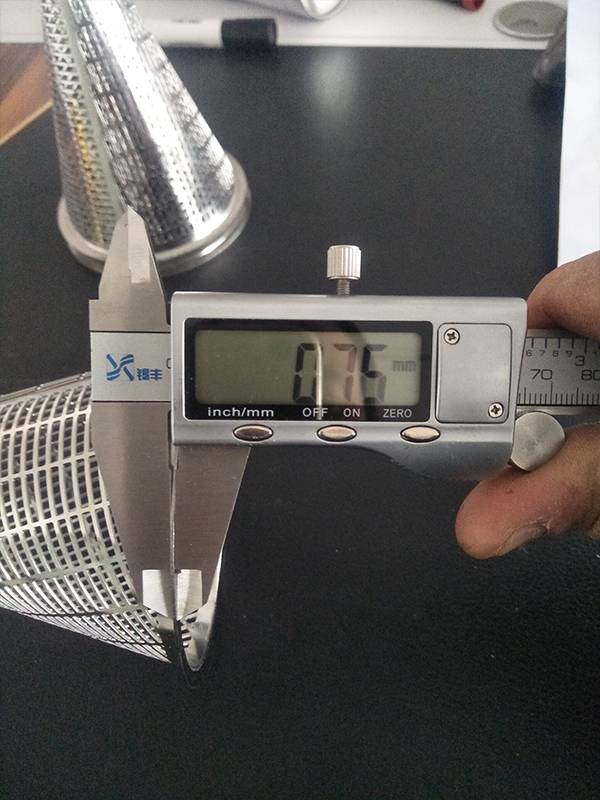 Measure bottom edge thickness of cone strainer with vernier caliper to be 0.75 mm