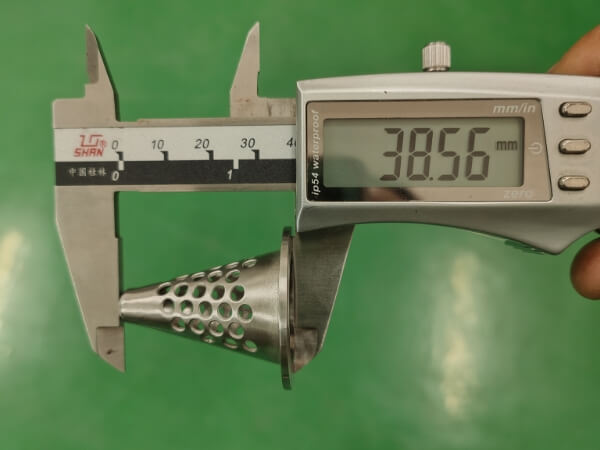 The overall height of the small conical perforated filter element is 38.56 mm.