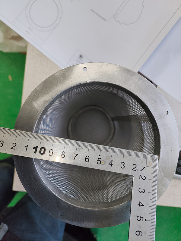 The flange inner diameter is measured to be 112 mm using a caliper.