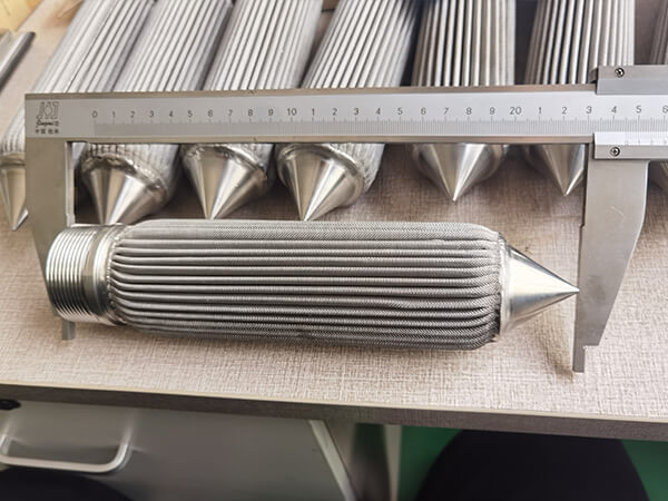 Measure filter element length with a large vernier caliper on table