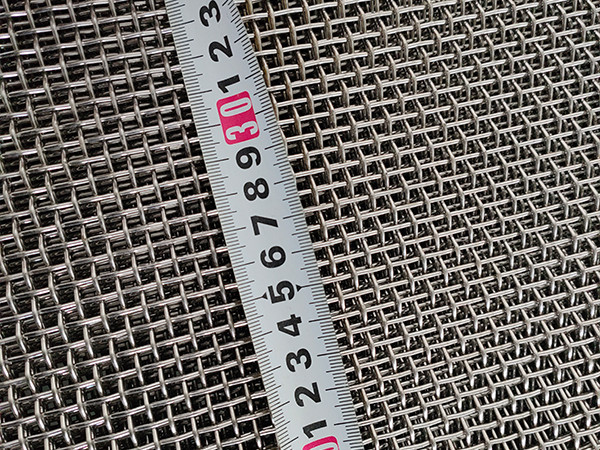 A meter placed on a piece of screen mesh